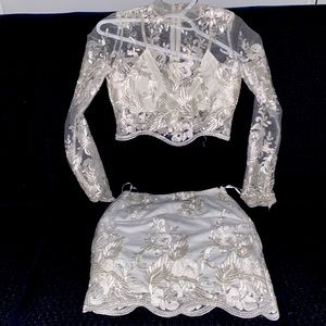 Two-piece set. Very cute/sexy Skirt & top great for summer event. Size Small